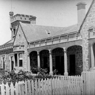 A black and white photograph of the stone-masonry front of St Francis House.