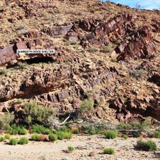 A hillside covered with steep rocky outcrops.